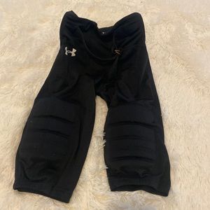 Medium under armor football pants with pads. Smoke free home.